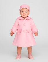 Abrigo rosa para bebé niña Gerat con cuello y detalles de moño