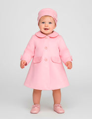 Abrigo rosa para bebé niña Gerat con cuello y detalles de moño